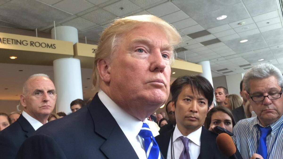 
Donald Trump speaks to reporters during a stop in Greenville in August.

