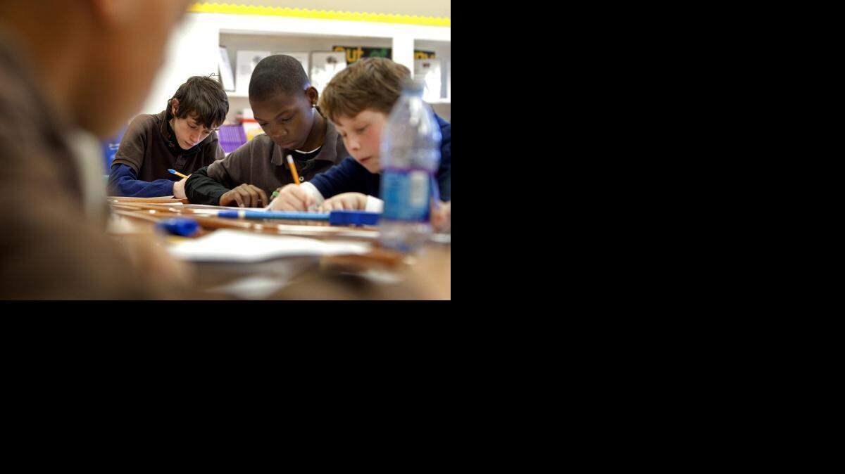 
FILE PHOTO: (2011) Spartanburg Charter School sixth-graders work on a math problem 
