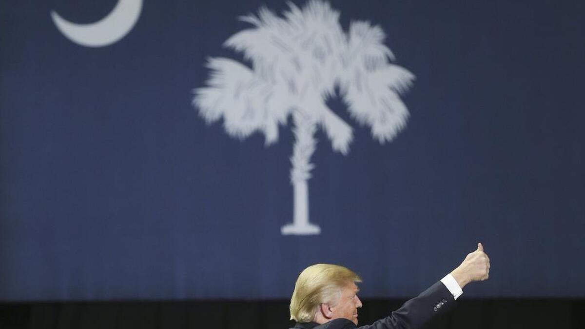 Republican presidential candidate Donald Trump arrives at a rally in Florence on Friday.