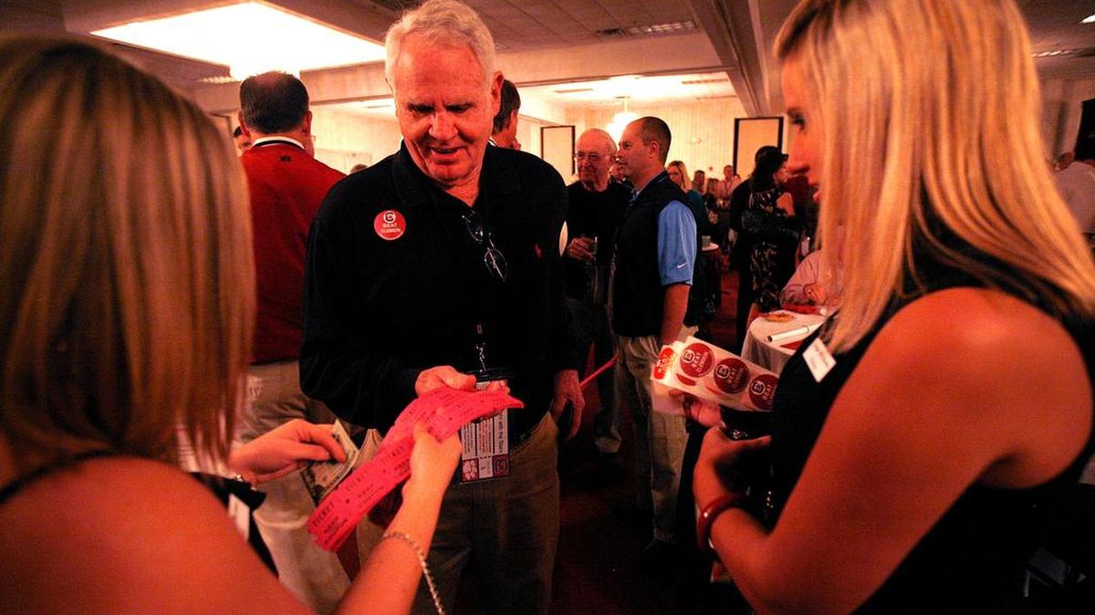 Ray Curtis of Columbia purchases tickets for the lottery drawing in a 2010 Night With The Stars fundraiser for Palmetto Health Richland Trauma Unit.