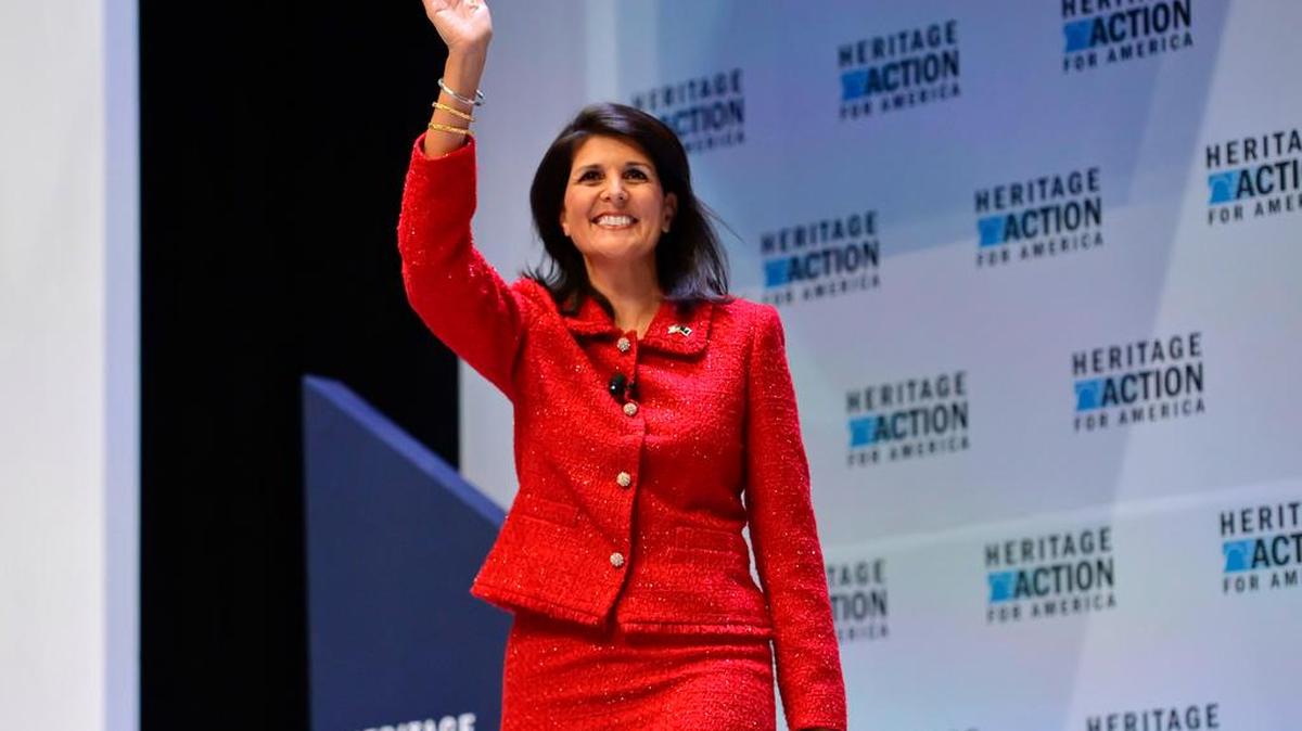 
S.C. Gov. Nikki Haley waves as she walks onto the stage at presidential forum sponsored by Heritage Action at the Bon Secours Wellness Arena in Greenville on Sept. 18.
