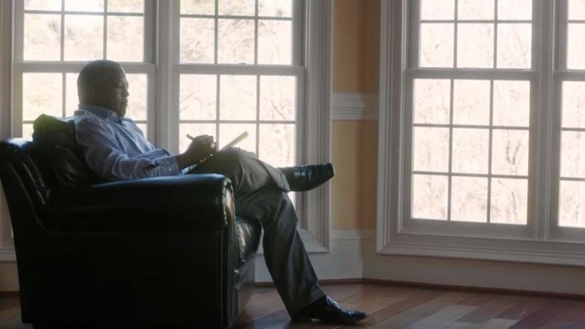 A shot from a new television advertisement of Columbia Mayor Steve Benjamin writing a letter to his daughters about why he is endorsing Hillary Clinton for president.