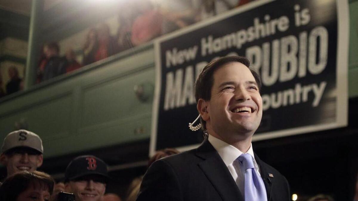 Republican presidential candidate, Sen. Marco Rubio, R-Fla., center, is surrounded by members of an audience as he prepares for a television interview before a campaign event last week in Exeter, N.H.