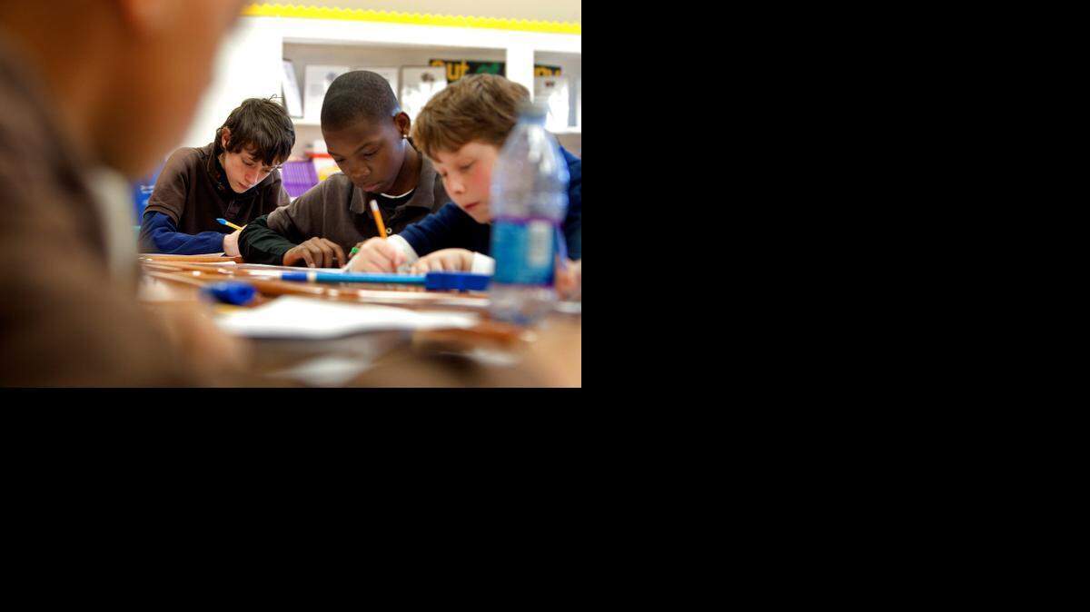 
FILE PHOTO: (2011) Spartanburg Charter School sixth-graders work on a math problem 
