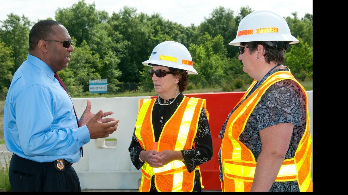 
S.C. Secretary of Transportation Janet Oakley, center, speaks with state Department of Public Safety Director Leroy Smith and DOT Deputy Director for Engineering Christy Hall about a hurricane evacuation lane-reversal drill in Columbia in 2014. 
