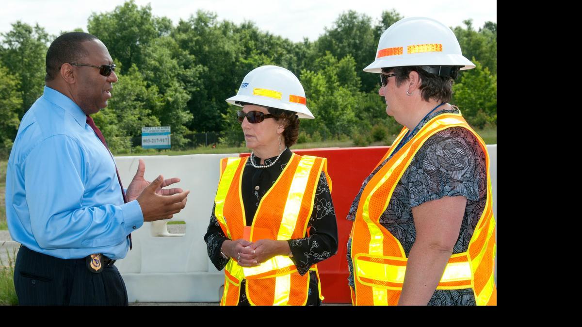 
S.C. Secretary of Transportation Janet Oakley, center, speaks with state Department of Public Safety Director Leroy Smith and DOT Deputy Director for Engineering Christy Hall about a hurricane evacuation lane-reversal drill in Columbia in 2014. 

