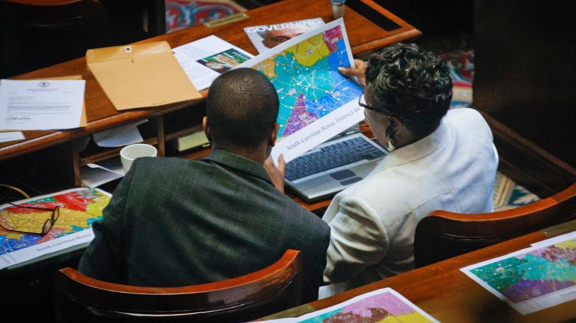 Rep. Bakari Sellers, D-Bamberg, left, and Rep. Gilda Cobb-Hunter, D-Orangeburg, right, look at redistricting maps in a 2011 session of the South Carolina Legislature.