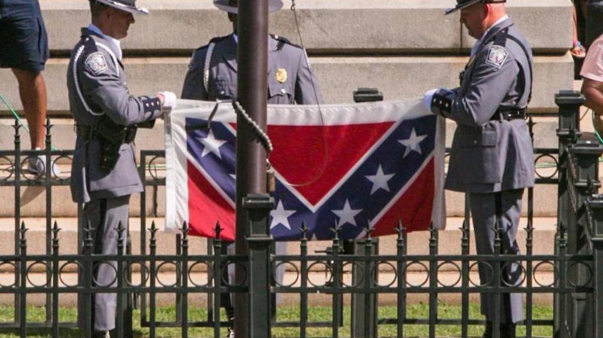The Confederate battle flag being removed from its pole on the S.C. State House grounds July 10, 2015