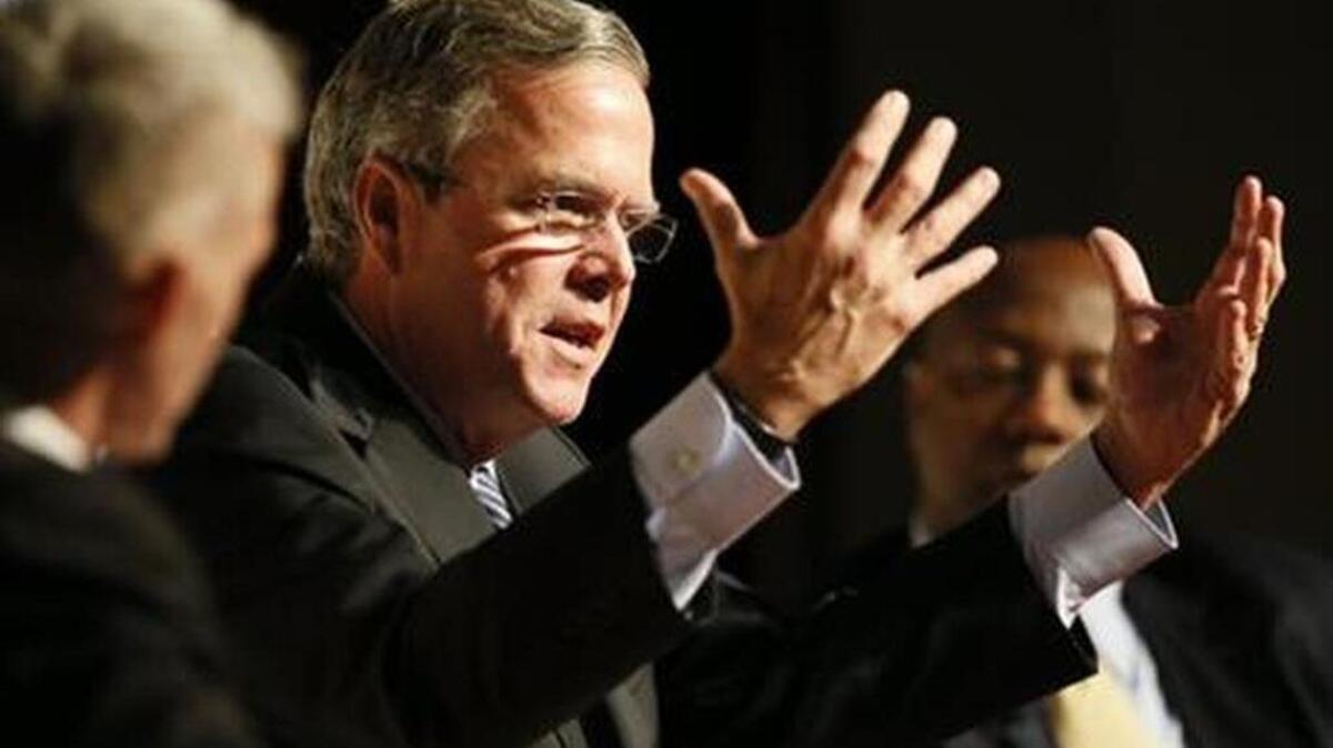 Republican presidential candidate Jeb Bush answers questions from the crowd during U.S. Senator Tim Scott’s town hall event Saturday at Bishop England High School on Daniel Island, S.C.