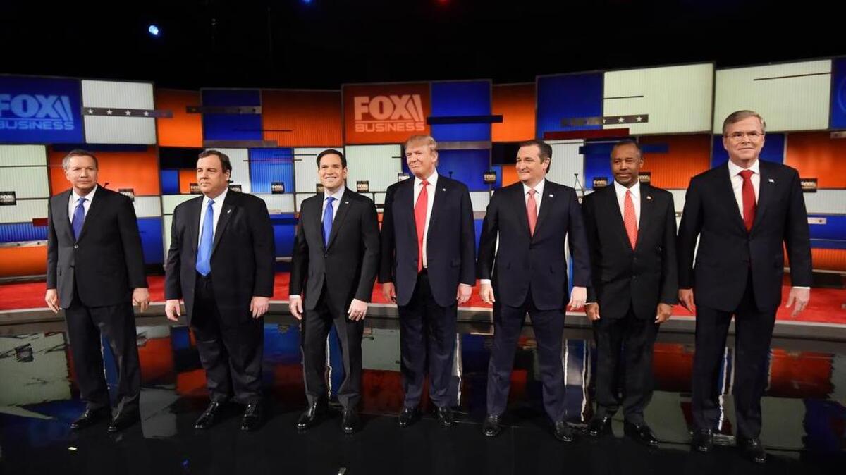 Republican presidential candidates, from left, Ohio Gov. John Kasich, New Jersey Gov. Chris Christie, Sen. Marco Rubio, R-Fla., businessman Donald Trump, Sen. Ted Cruz, R-Texas, retired neurosurgeon Ben Carson and former Florida Gov. Jeb Bush take the stage before the Fox Business Network Republican presidential debate at the North Charleston Coliseum, Thursday, Jan. 14, 2016, in North Charleston, S.C.