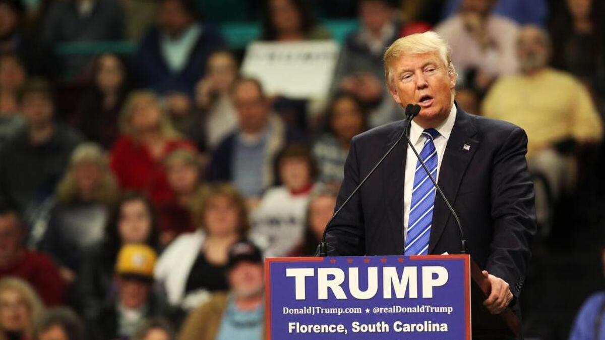 Presidential candidate Donald Trump talks to supporters during his rally at the Florence Civic Center on Friday.