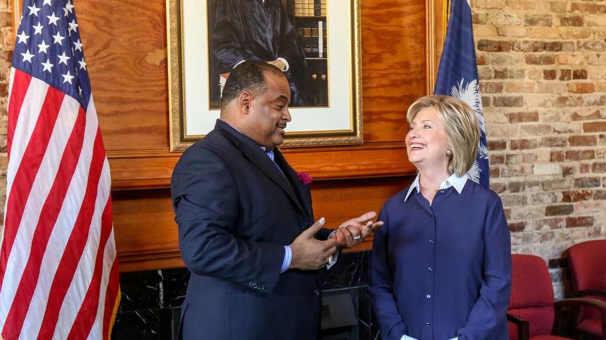 Roland Martin, Host and Managing Editor TV One’s News One Now, speaks with Democratic Presidential candidate Hillary Clinton moments before the town hall meeting hosted by the South Carolina Legislative Black Caucus, Saturday, Nov. 7, 2015, at Ministers Hall on the Campus of Claflin University in Orangeburg, SC. (Richard Burkhart/AP Images for TV One)