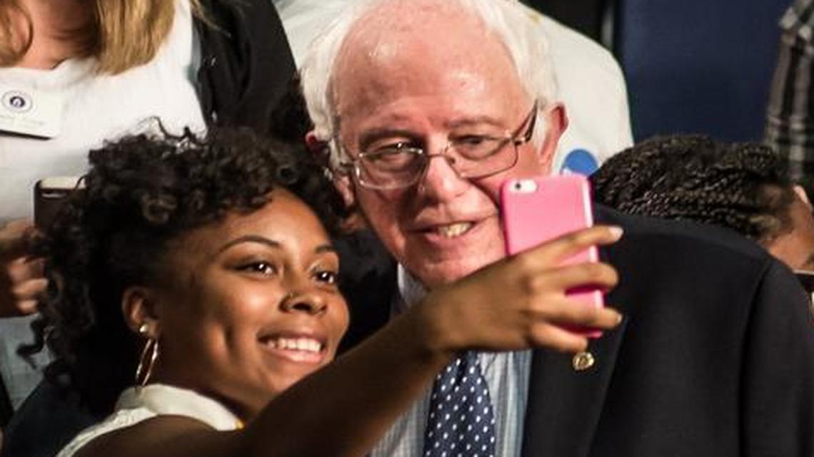 
Democratic presidential candidate U.S. Sen. Bernie Sanders poses for photos with freshman Saja Hargrow at a college town hall meeting Saturday morning at Benedict College. 
