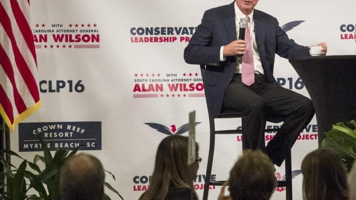 Presidential candidate and Ohio governor John Kasich answers questions from S.C. Attorney General Alan Wilson and from the audience at the Conservative Leadership Project at The Crown Reef Resort in Myrtle Beach on Tuesday.
