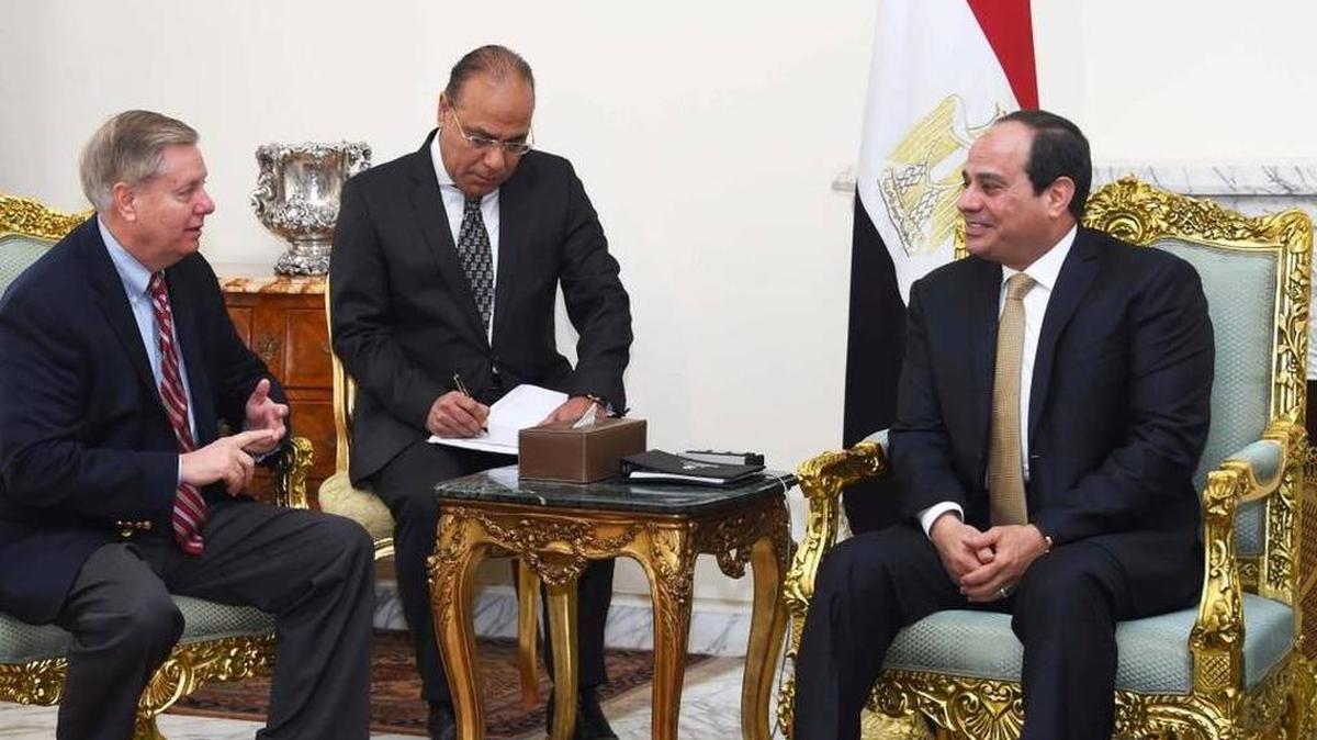 In this photo provided by Egypt’s state news agency, MENA, Egyptian President Abdel-Fattah el-Sissi, right, meets with Republican Sen. Lindsey Graham, left, at the office of the presidency in Cairo.