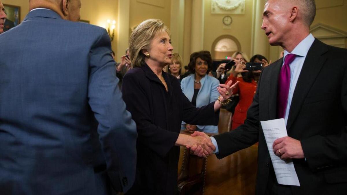 Democratic presidential candidate, former Secretary of State Hillary Rodham Clinton talks with House Select Committee on Benghazi chairman Rep. Trey Gowdy, R-S.C., right, and ranking member Rep. Elijah Cummings, D-Md., at the conclusion of last week’s hearing.
