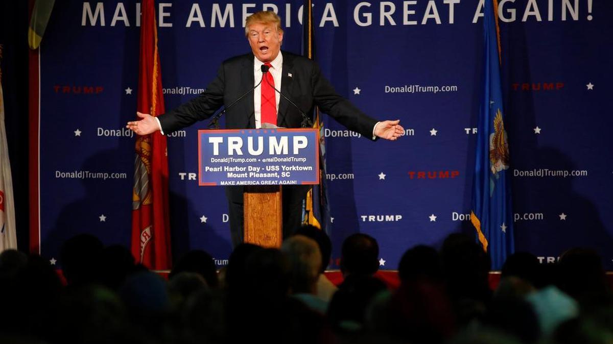 Republican presidential candidate, businessman Donald Trump, speaks during a rally coinciding with Pearl Harbor Day at Patriots Point aboard the aircraft carrier USS Yorktown in Mt. Pleasant, S.C., Monday, Dec. 7, 2015. Trump defended his plan, Tuesday, Dec. 8, 2015, for a "total and complete shutdown of Muslims entering the United States" by comparing it with President Franklin Roosevelt's decision to inter Japanese Americans during World War II.