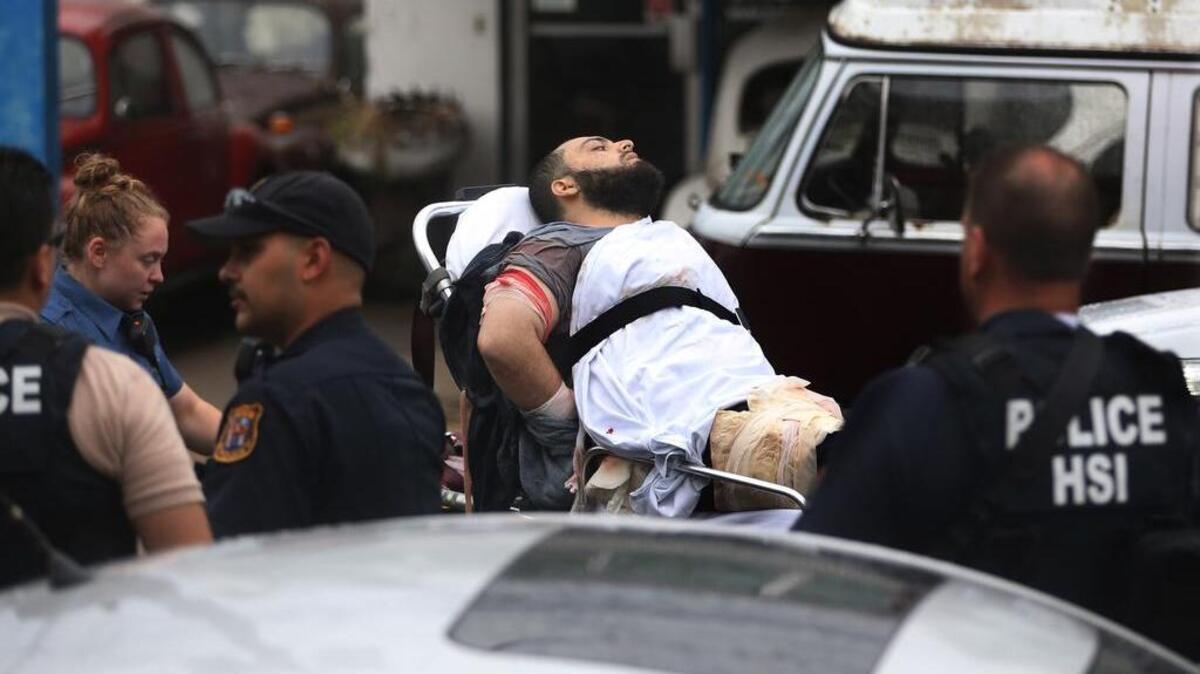 Ahmad Khan Rahami is taken into custody after a shootout with police Monday, Sept. 19, 2016, in Linden, N.J. Rahami was wanted for questioning in the bombings that rocked the Chelsea neighborhood of New York and the New Jersey shore town of Seaside Park.