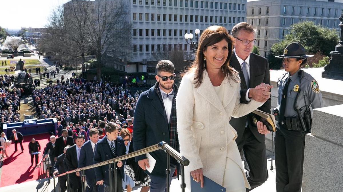 Lt. Gov. Pamela Evette and husband, David, head back into the State House after the 97th Inauguration ceremony.