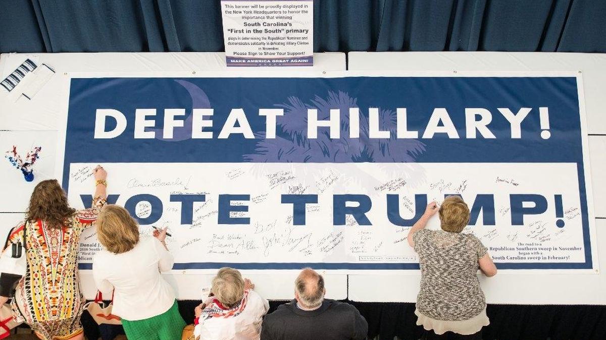 Voters sign a banner during the South Carolina Republican state convention at the Columbia Metropolitan Convention Center Saturday morning in Columbia. South Carolina Republicans gathered Saturday to elect their delegates to the party's presidential nominating convention in Cleveland.