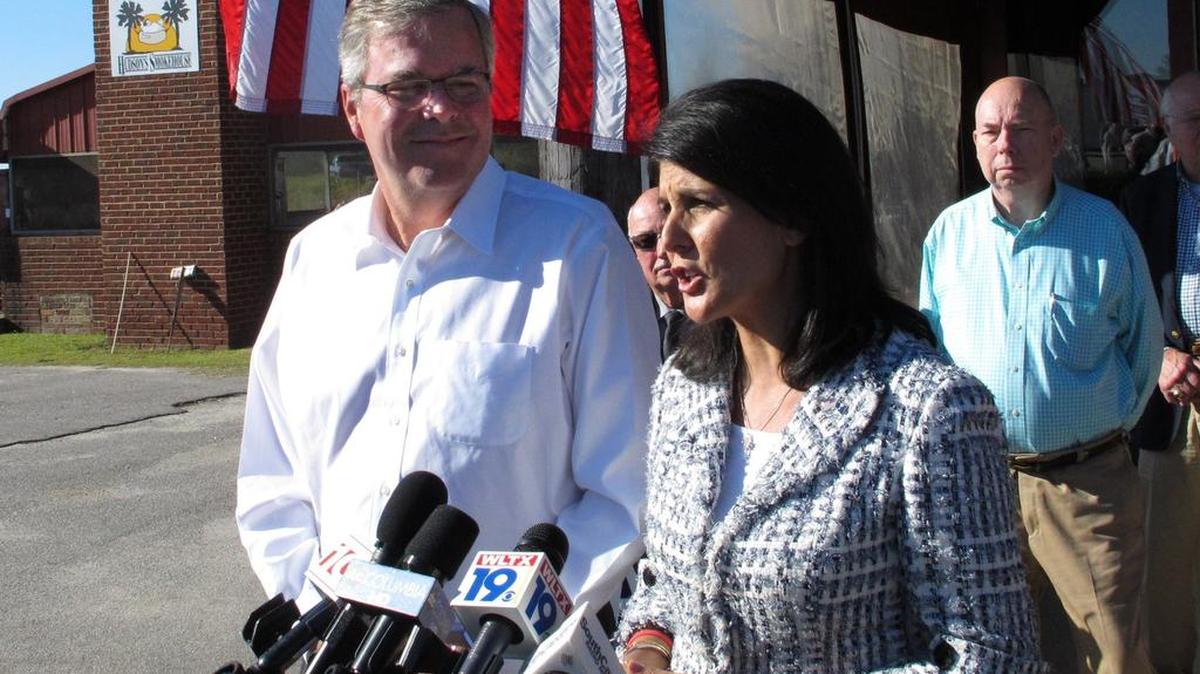 S.C. Gov. Nikki Haley, right, speak to reporters as former Florida Gov. Jeb Bush, left, listens after a Haley campaign event in 2014, in Lexington.