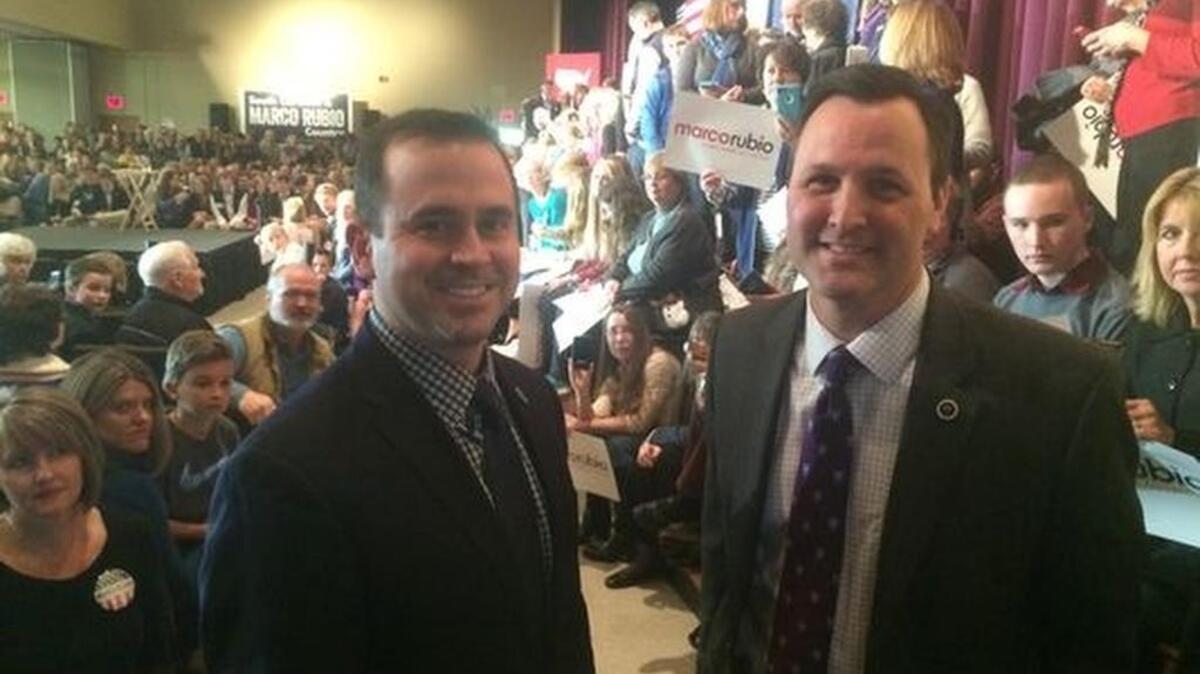 State Reps. Neal Collins of Easley, left, and Dan Hamilton of Taylors wait for Republican presidential candidate Marco Rubio at Southside Christian School in Greenville Thursday.