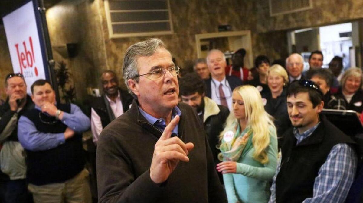 Presidential candidate Jeb Bush talks to supporters at Venus Restaurant in Florence on Thursday, Feb. 11, 2016.