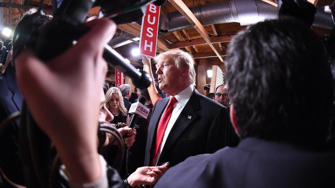 Republican presidential candidate, businessman Donald Trump speaks to the media in the spin room after the CBS News Republican presidential debate at the Peace Center in Greenville on Saturday.