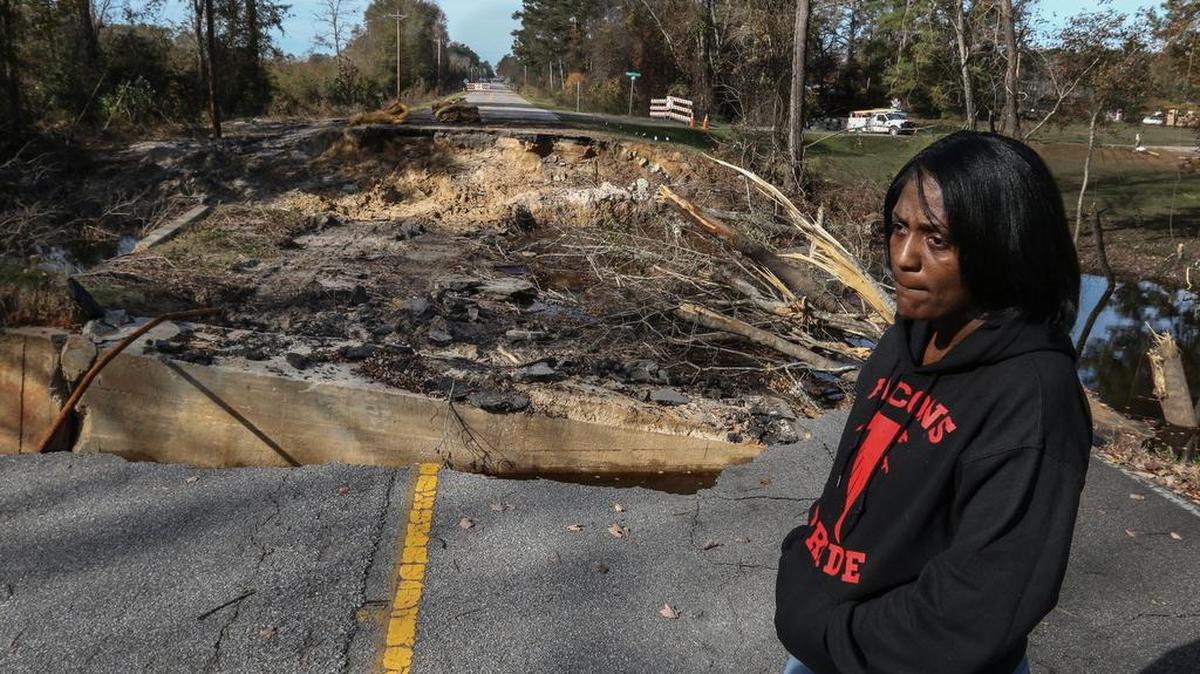Melissa Webber's brother's house is a short walk from her house on Bluff Road, but due to the road damage caused by the flood, she now has to drive a detour, taking about 20 minutes to visit.