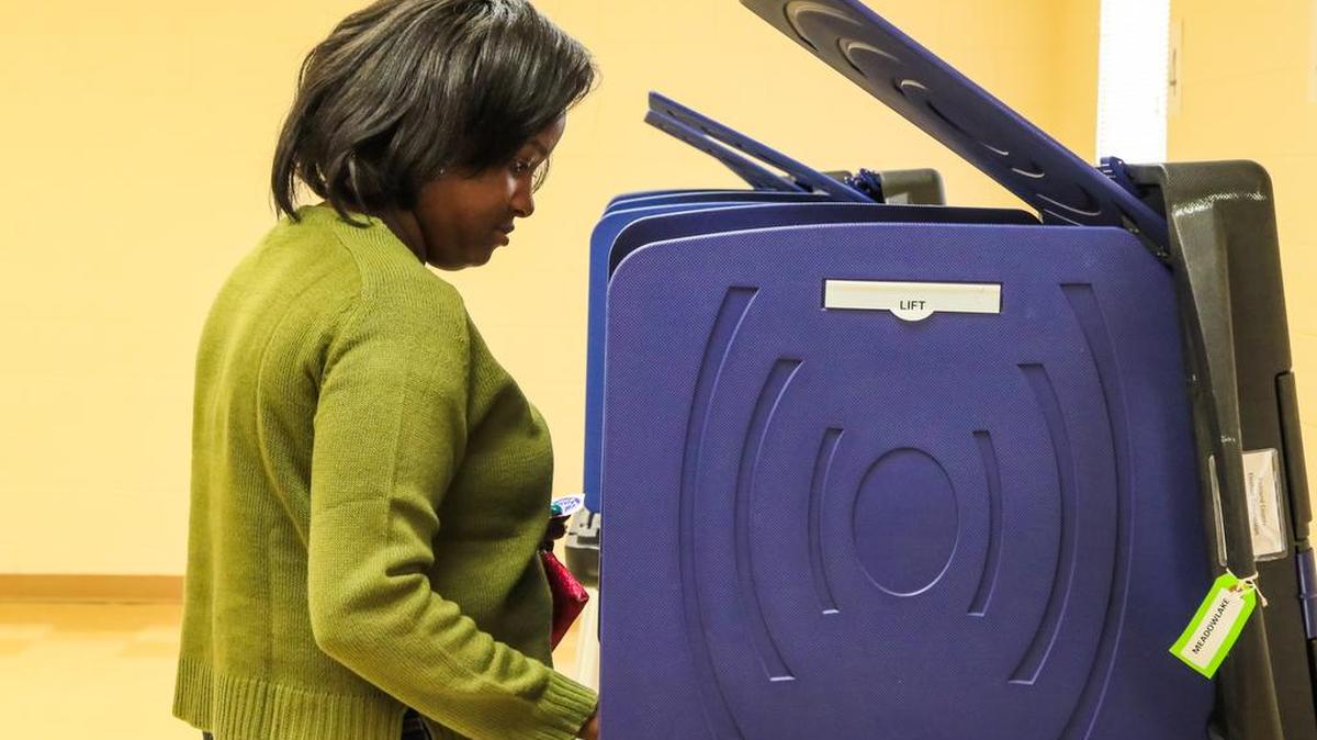 Dominique Cochran casts her vote at Meadowlake Park in north Columbia during the South Carolina Democratic Primary Saturday.