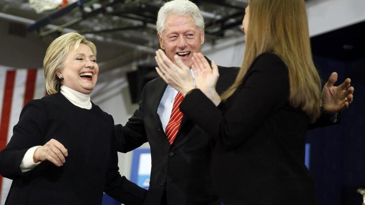 Democratic presidential candidate Hillary Clinton, former President Bill Clinton and their daughter Chelsea Clinton at a rally on Tuesday in Hooksett, N.H.
