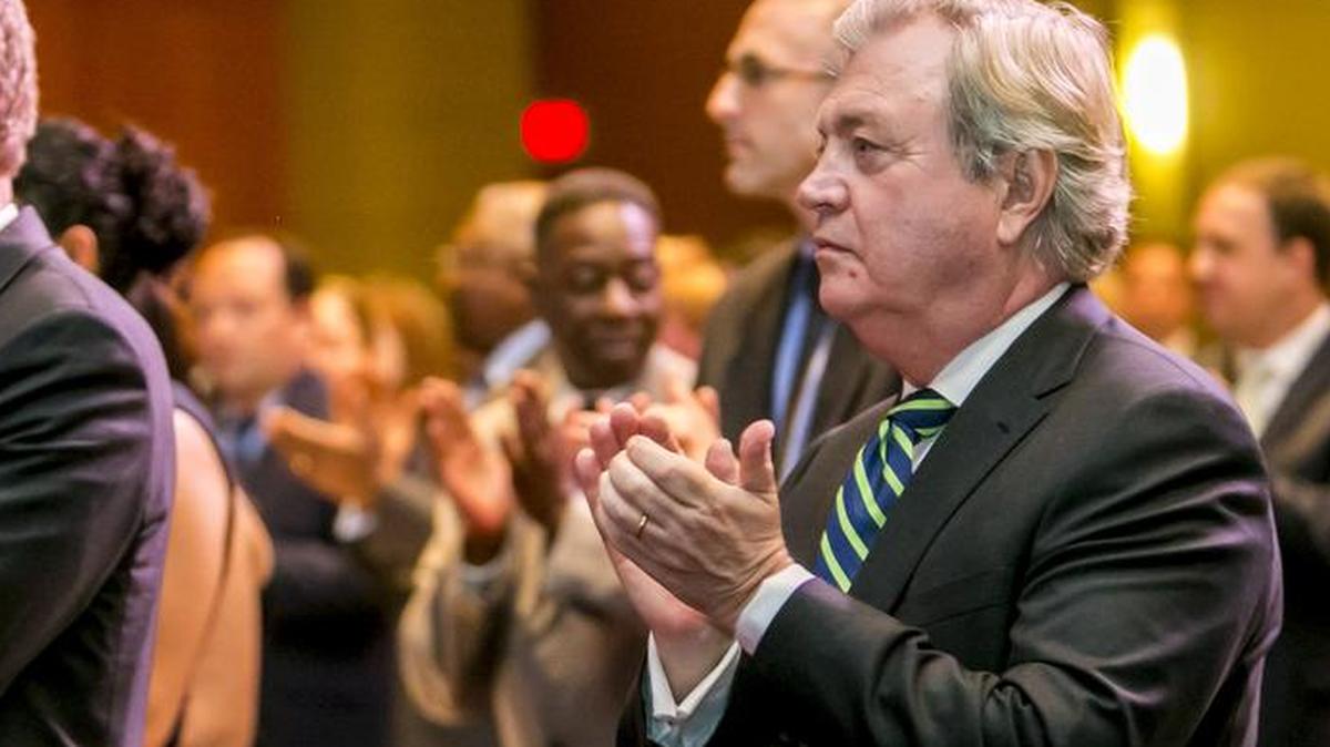 FILE PHOTO: U.S. Senator Mark Warner (D-Va.), left, and former S.C. Democratic Chairman Dick Harpootlian applaud during the South Carolina Democratic Party 2015 Dem Weekend at the Columbia Convention Center.