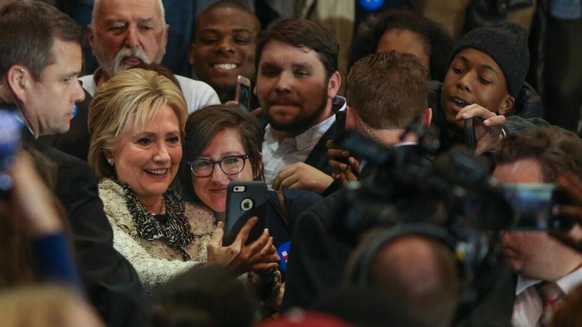 FILE PHOTO: Hillary Clinton makes photos with supporters at the Volleyball Center at the University of South Carolina after winning the South Carolina Democratic Primary in February.