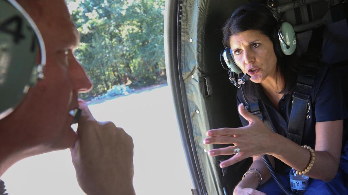 S.C. Gov Nikki Haley talks with U.S. Army Chief Warrant Officer Kent Puffenbarger, while assessing flood damage in Horry County last month.