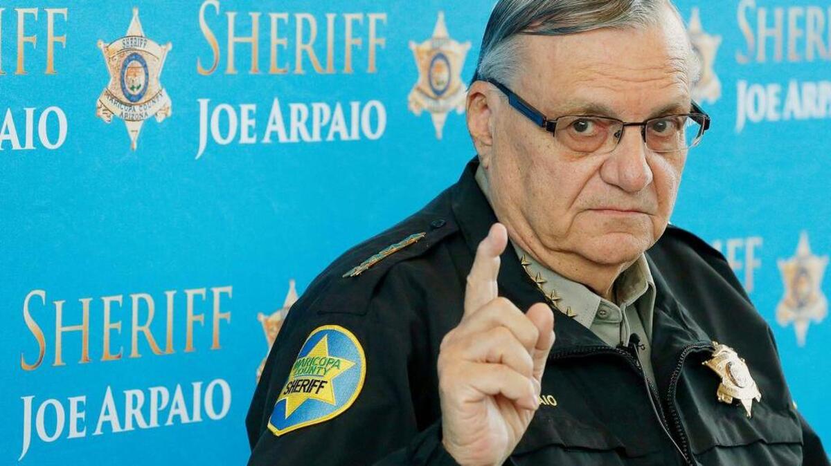In this Dec. 18, 2013, file photo, Maricopa County Sheriff Joe Arpaio speaks at a news conference at the Sheriff's headquarters in Phoenix, Ariz. The Arizona sheriff has refused to accept responsibility for launching a failed animal cruelty investigation against the son of one of the state's two U.S. senators. Sheriff Arpaio testified in a recently released deposition in a lawsuit by Sen. Jeff Flake's college-age son, who alleges the lawman brought a trumped-up case against him over the heat-exhaustion deaths of 21 dogs at a kennel operated by his in-laws.