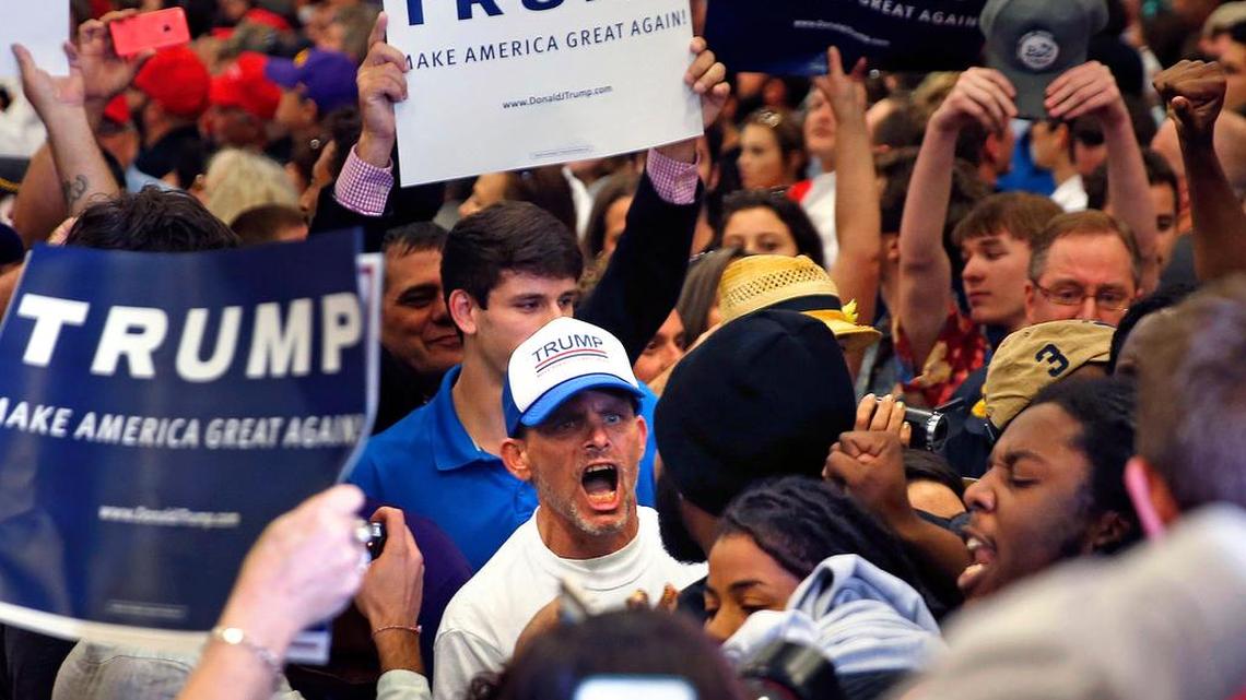 A supporter of Republican presidential candidate Donald Trump yells at protestors who were chanting "Black Lives Matter," while Trump was speaking Friday in New Orleans.