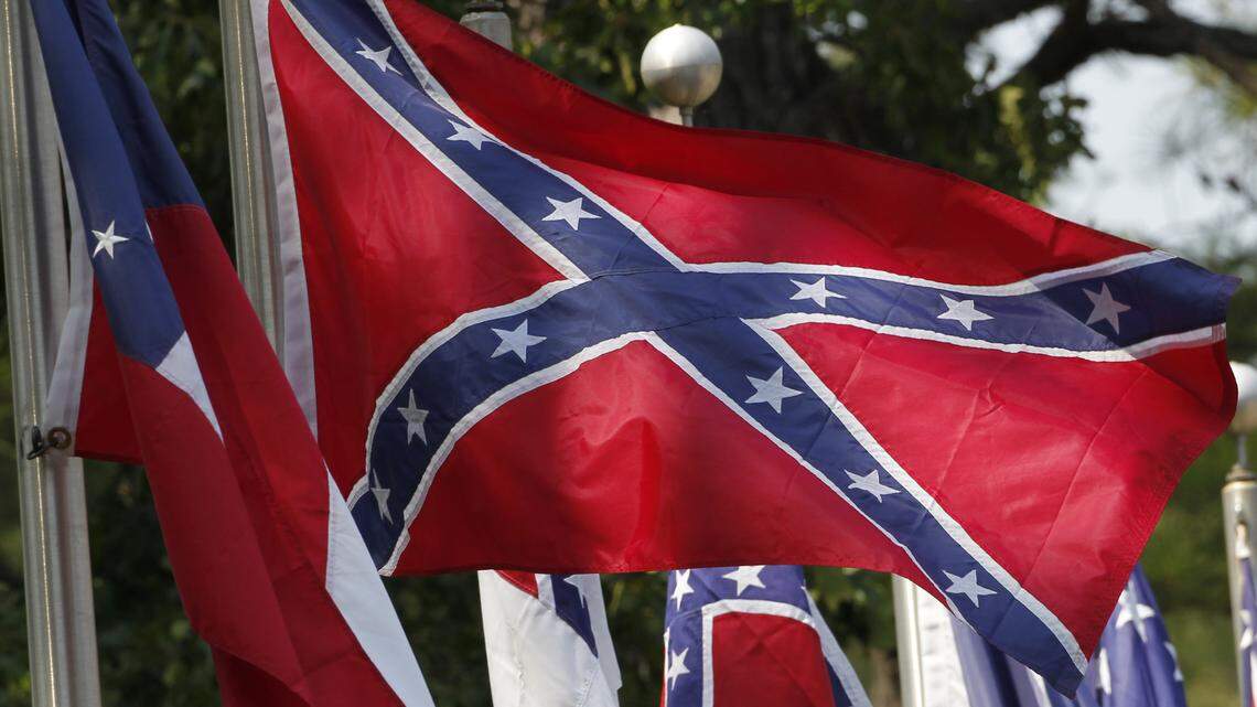 In this 2011 file photo, Confederate battle flags fly in Mountain Creek, Alabama.  Several students at Burns High School in Cleveland County, North Carolina, were suspended recently for flying Confederate flags from their trucks on school grounds.
