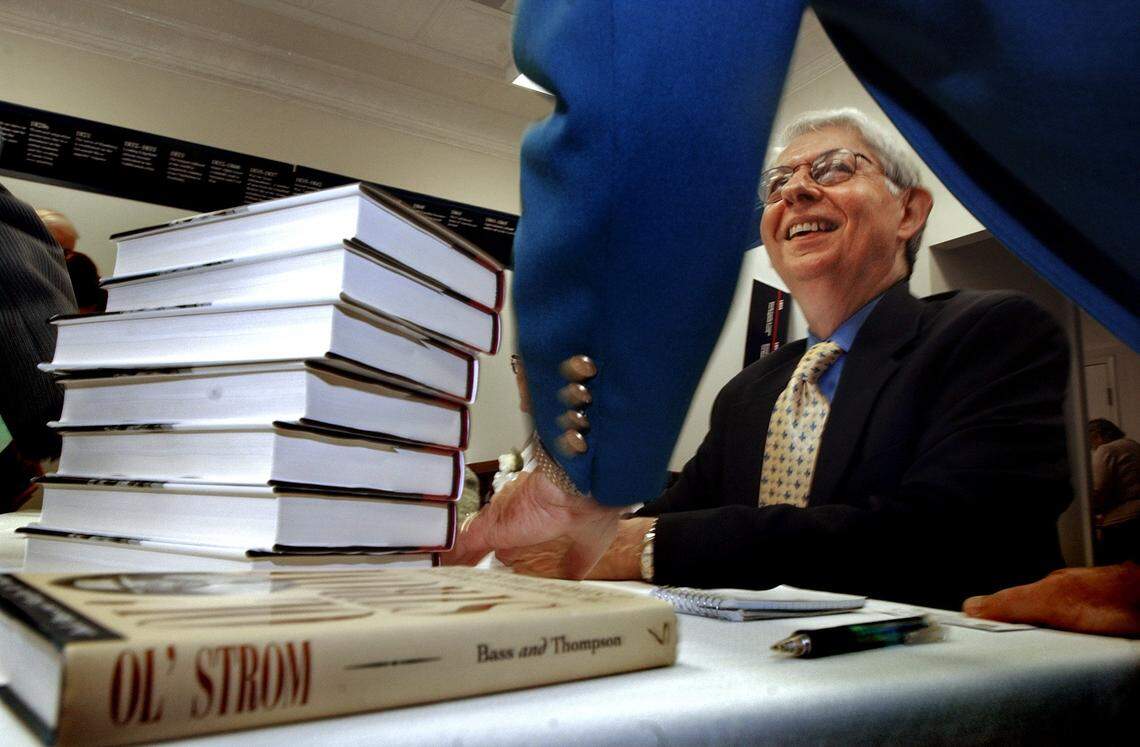 Author Jack Bass, sitting, chats with Edgefield mayor Bob McKie in 2005 after signing a copy of "Strom: The Complicated Personal and Political Life of Strom Thurmond," a new book Bass wrote with co-author Marilyn Thompson. Bass also ‘Ol’ Strom: An Unauthorized Biography of Strom Thurmond’ in 1998.
