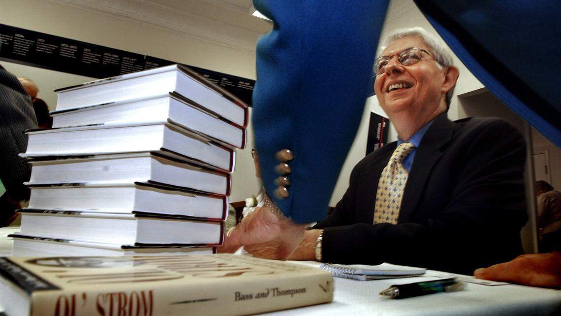Author Jack Bass, sitting, chats with Edgefield mayor Bob McKie in 2005 after signing a copy of "Strom: The Complicated Personal and Political Life of Strom Thurmond," a new book Bass wrote with co-author Marilyn Thompson. Bass also ‘Ol’ Strom: An Unauthorized Biography of Strom Thurmond’ in 1998.