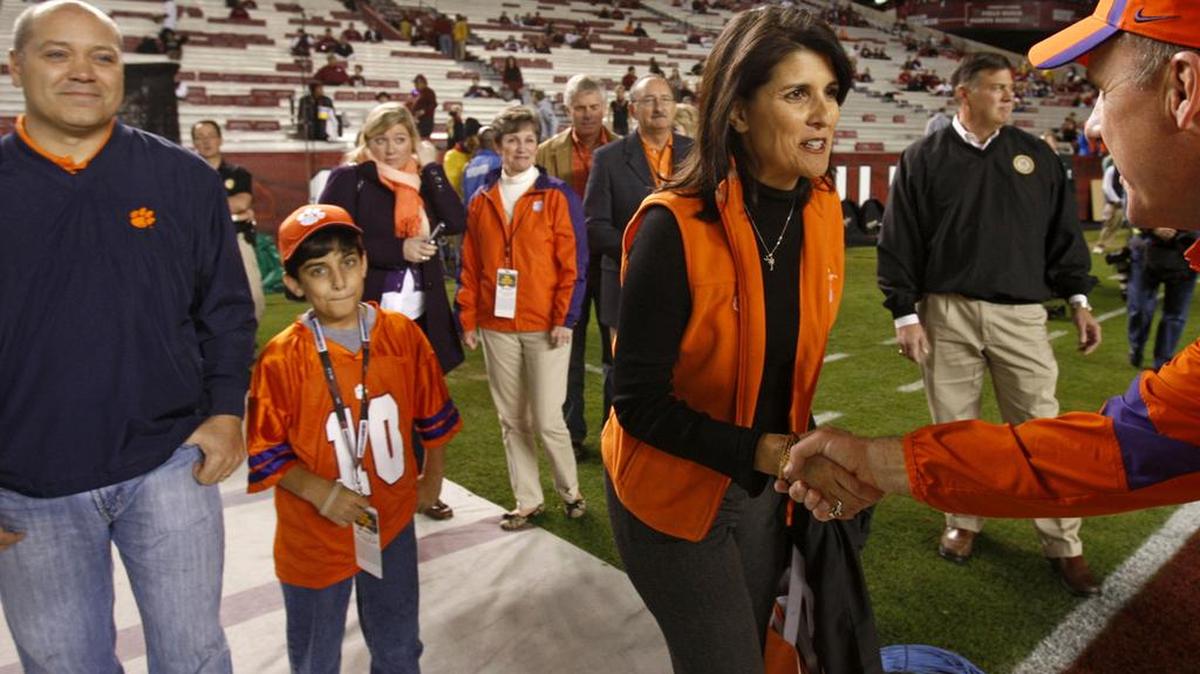 Then-Gov Nikki Haley shakes hands with Clemson offensive coordinator Chad Morris before the 2011 Clemson-South Carolina game.
