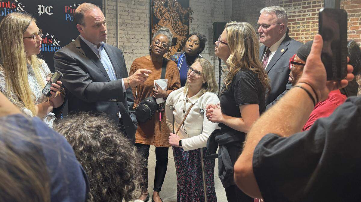 Attorney General Alan Wilson speaks with attendees after a Post and Courier Pints and Politics event on Wednesday, Feb. 26, 2025 at Savage Craft in West Columbia. A security presence was visible at the event.