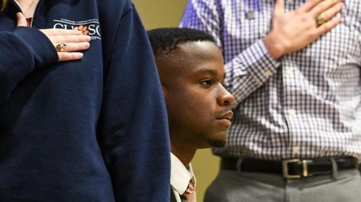 Vice President Jaren Stewart, sits between Secretary Kara Donovan, left, President Leland Dunwoodie, middle, for the Pledge of Allegiance during the Clemson Undergraduate Student Senate meeting in the Student Union in Clemson.