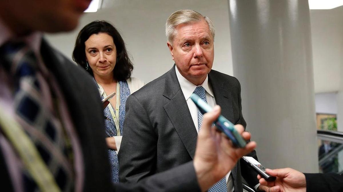 Sen. Lindsey Graham, R-S.C. is followed by reporters on Capitol Hill in Washington, Tuesday, May 23, 2017.