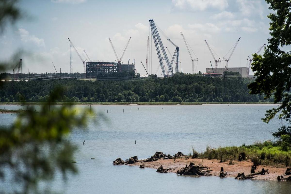 FILE: Construction at the V.C. Summer Nuclear Facility as seen from Parr Shoals Reservoir on July 7, 2017, in Jenkinsville, S.C.