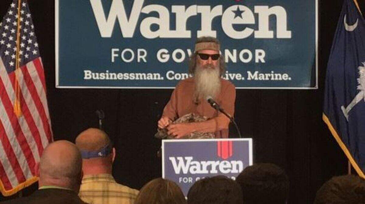 Phil Robertson, of the Duck Dynasty reality TV show, appears on stage in Greenville to stump for John Warren for governor.