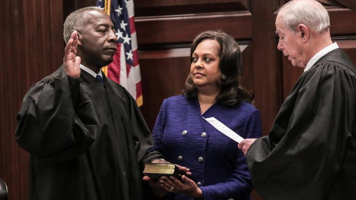 Donald Beatty is sworn in as the second African-American to be chief justice of the South Carolina Supreme Court Friday. He succeeds Costa Pleicones, right, who retired after reaching the mandatory retirement age of 72. Beatty’s wife Angela is in the center.