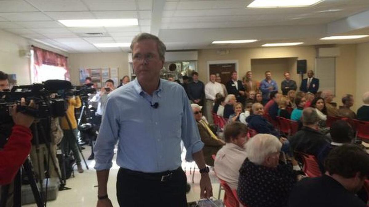 Former Florida Gov. Jeb Bush heads toward the podium in the dining hall at the Salvation Army’s campus on Rutherford Street Tuesday.