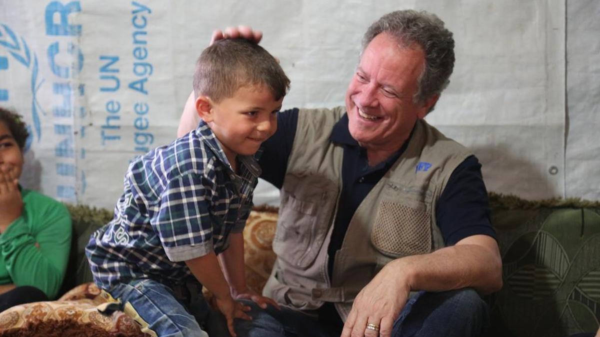 David Beasley plays with Ahmed, the youngest of the six Al Rahmu children living in the Adams Informal Tented Settlement for Syrian refugees in the Bekaa Valley, Lebanon.