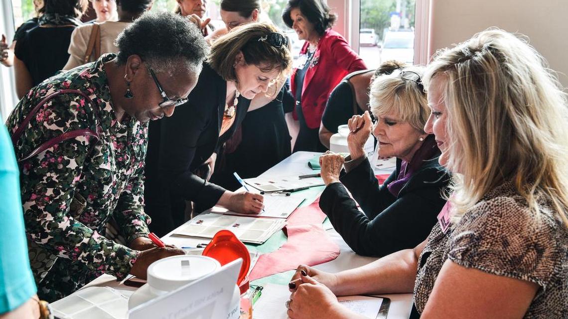 Women check into the 25th Annual "I Believe Anita Hill" event.