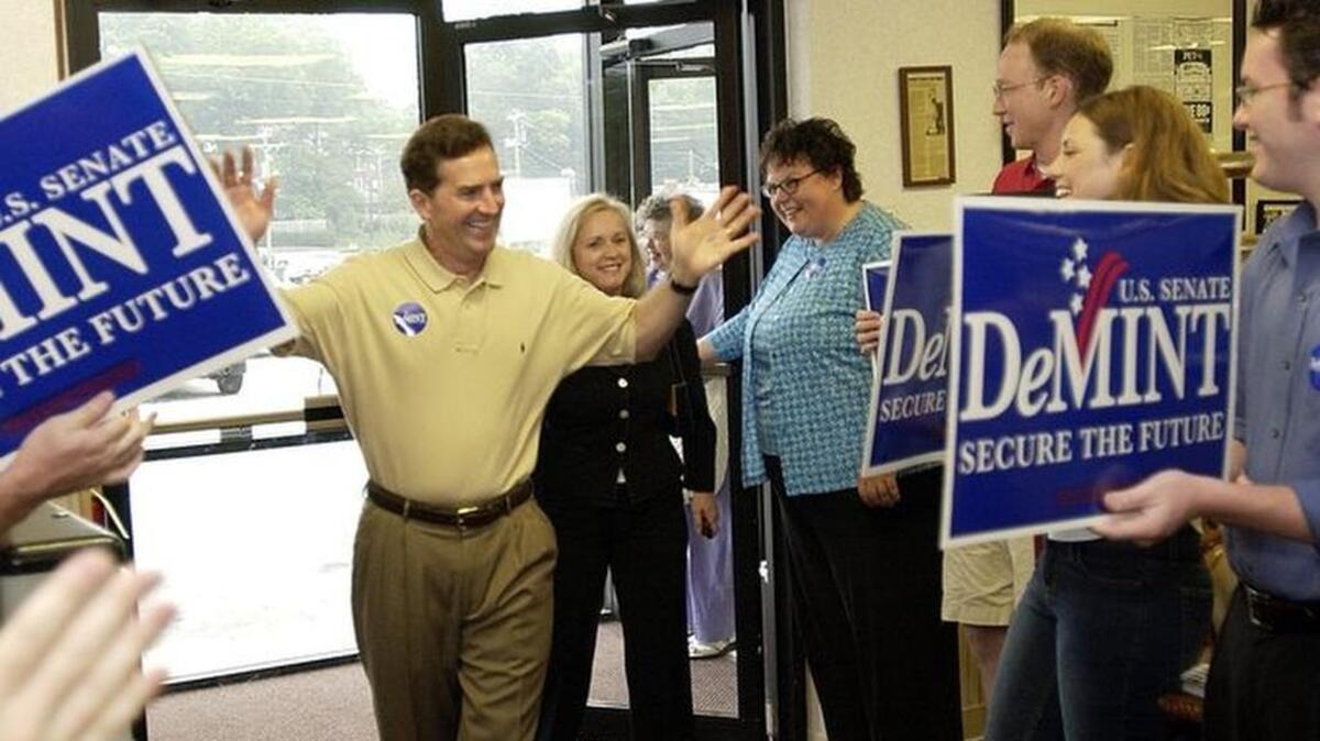 Supporters greet Jim DeMint and his wife Debbie on his visit to Tommy’s Ham House.